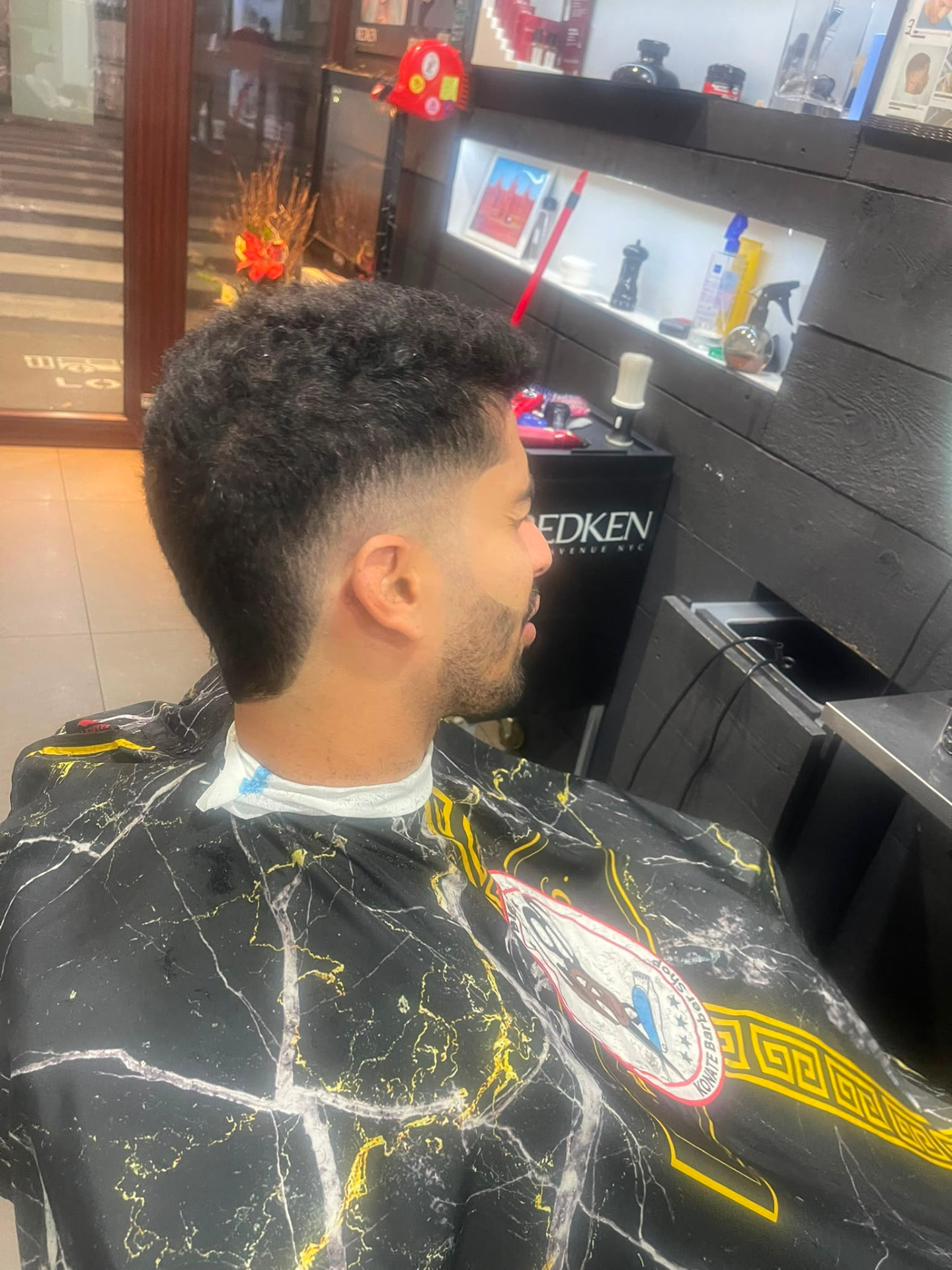 Textured afro with skin fade and beard line-up
